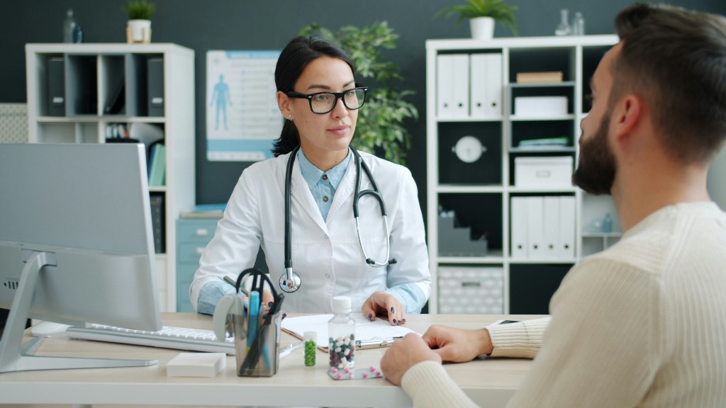 Clinician consulting with a patient during an in-person visit